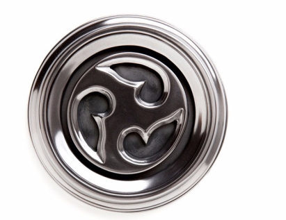 Round tile with a swirl motif in polished silver