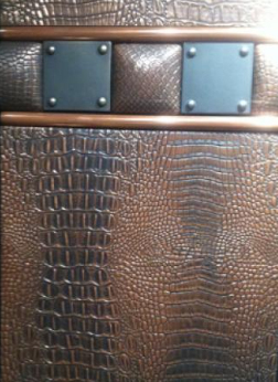Copper-finish panel with crocodile texture and rivet squares
