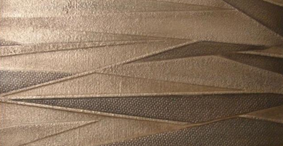 Wall panel with angular wave relief in brushed bronze