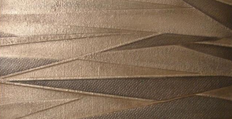 Wall panel with angular wave relief in brushed bronze